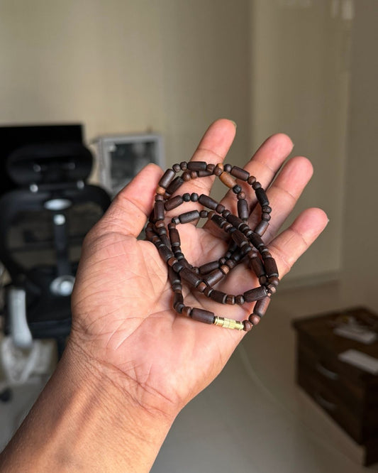 Close up of 2 Round Dark Brown Tulsi Kanthi Mala showing natural Tulsi wood beads