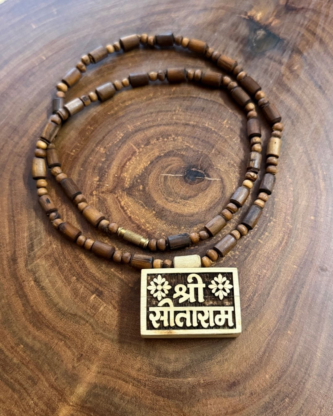 Close up of Sitaram Bhaktamal Tulsi Mala with Dark Brown Beads showing natural Tulsi wood beads