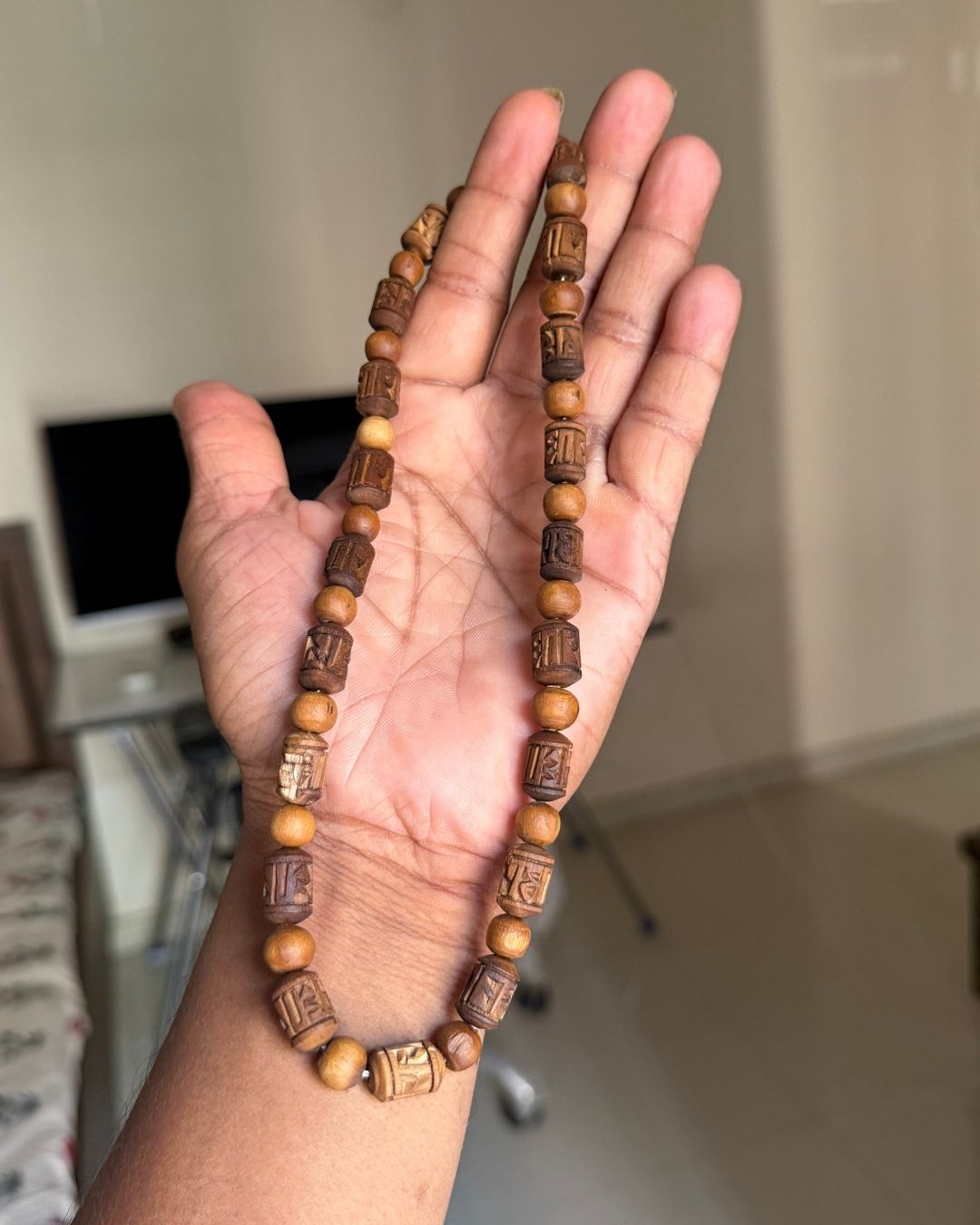 Close-up image of 2 Round Radha Name Dark Brown Original Tulsi Mala highlighting natural Tulsi beads and Radha name craftsmanship.