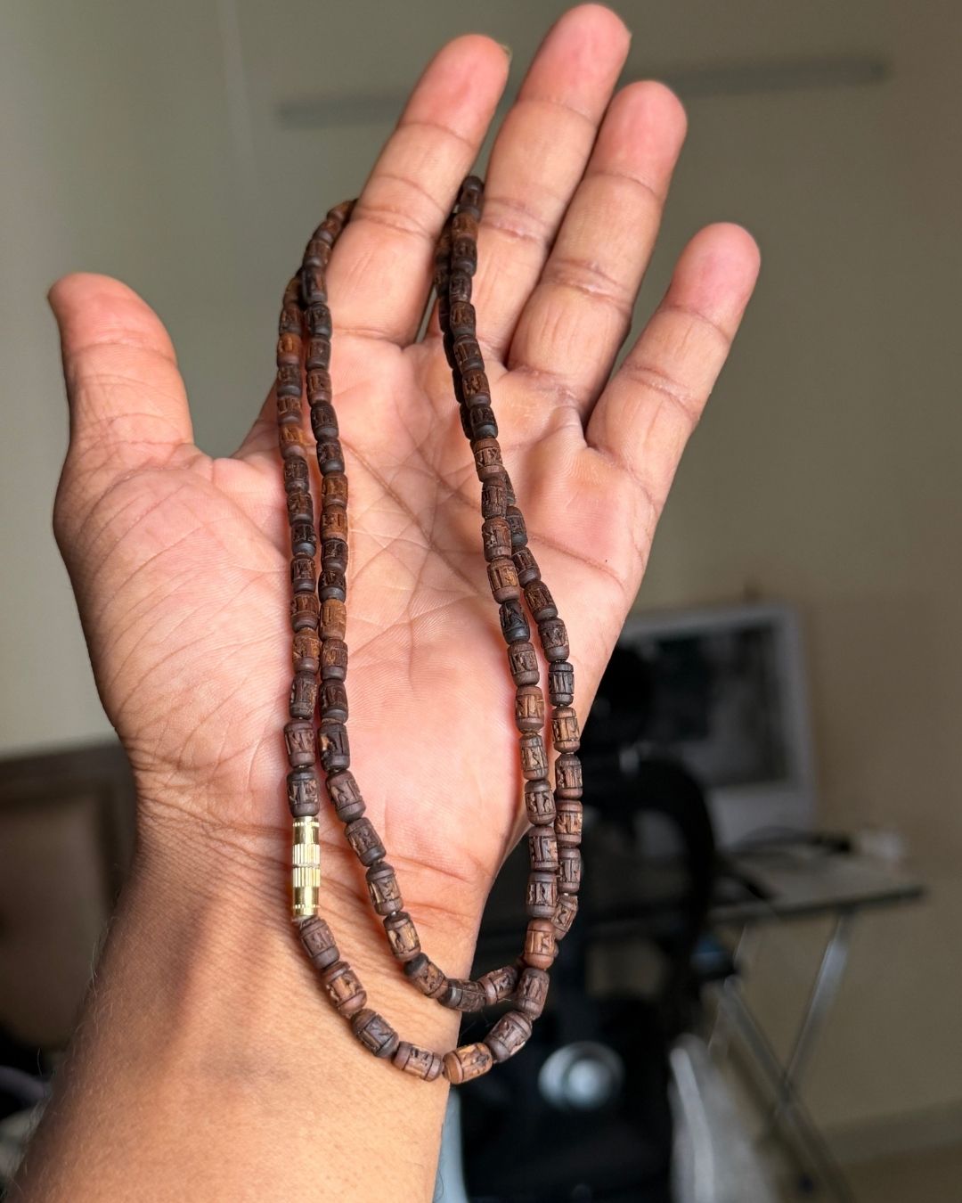 Natural dark brown Tulsi Mala featuring Radha name beads in a 2 round design