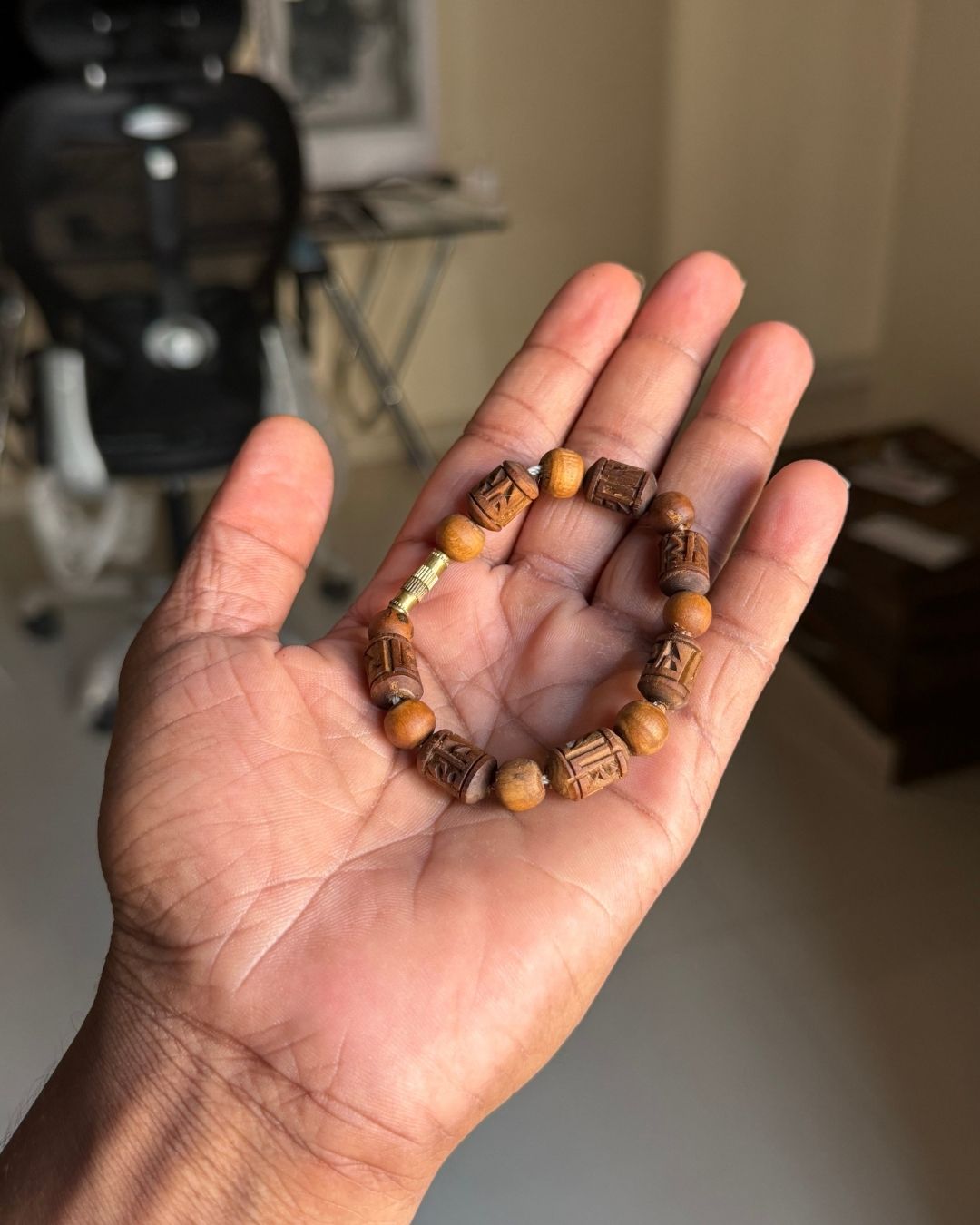 Close up of Radha Name Brown Tulsi Bracelet with smooth round Tulsi beads